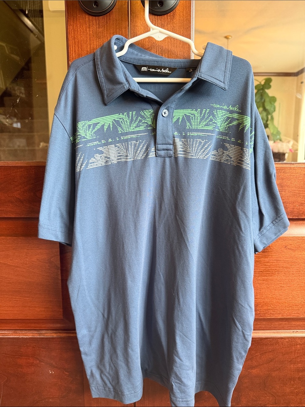 Travis Mathew Navy Polo with Green Stripe Graphic Kids